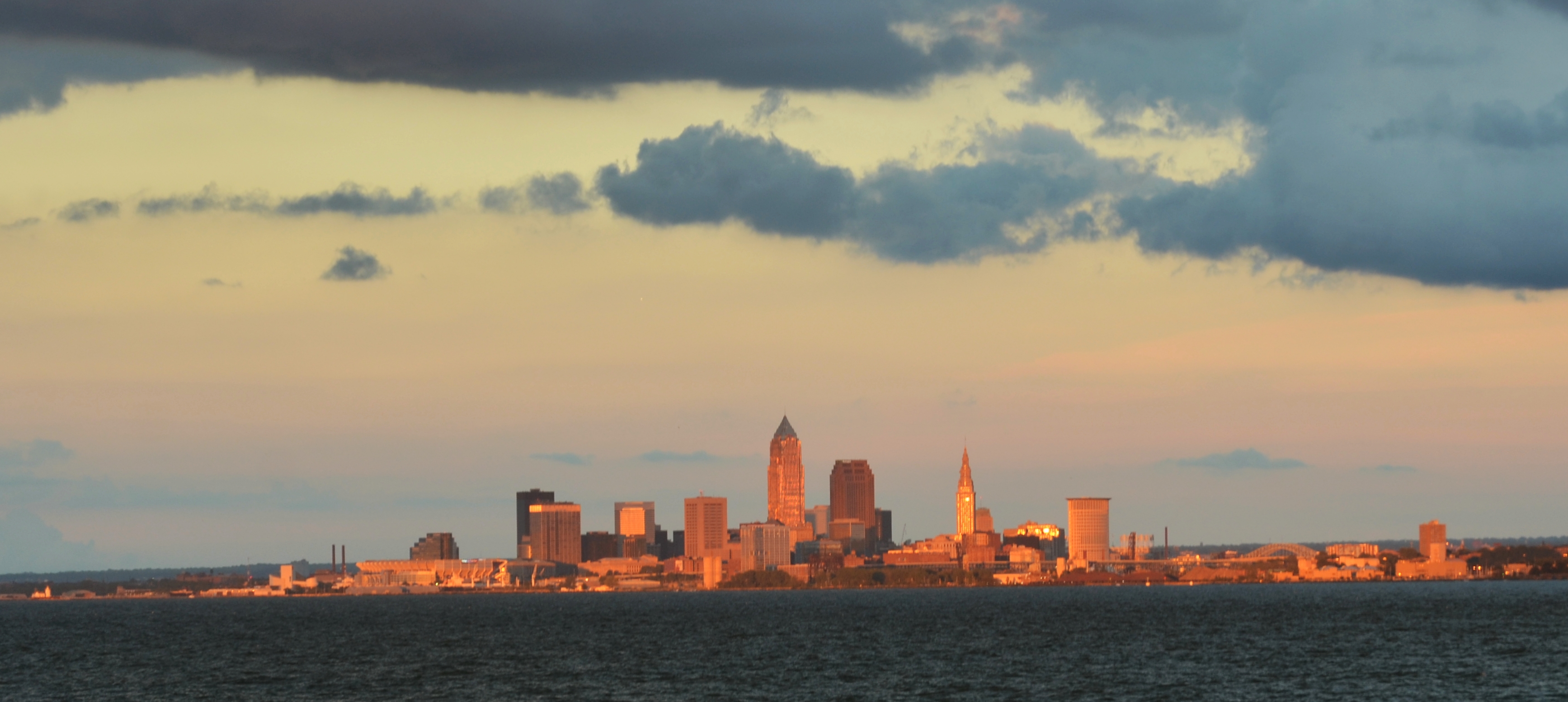 Cleveland skyline seen across Lake Erie from Lakewood Park at sunset